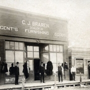 Who are the 5 men out front? What year is it?